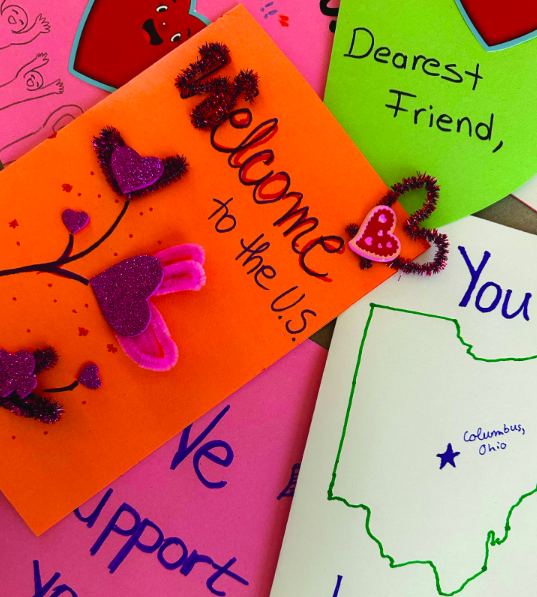 Global Fellows writes notes of welcoming affirmation to immigrants